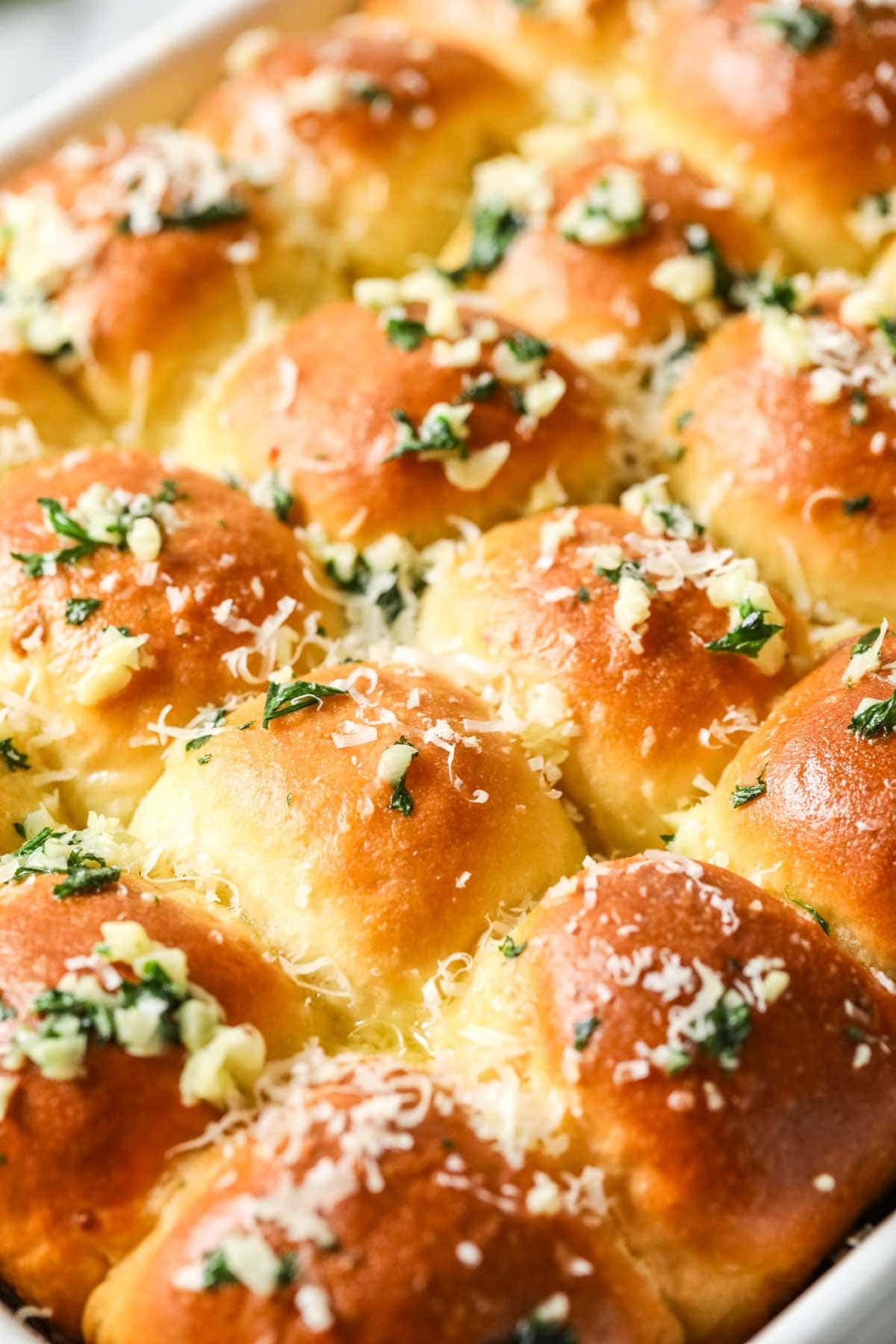 Close-up view of garlic bread dinner rolls.