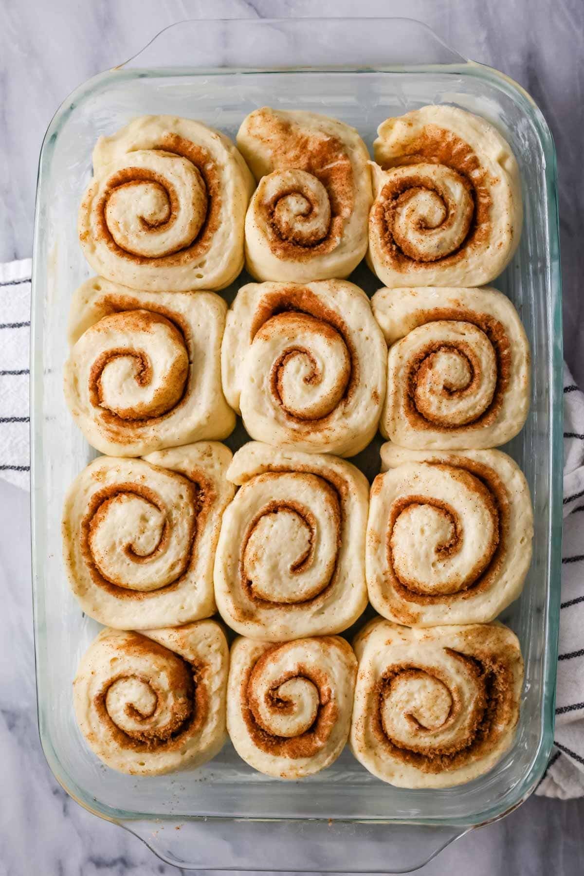 Overhead view of Amish cinnamon rolls after proofing (before baking).