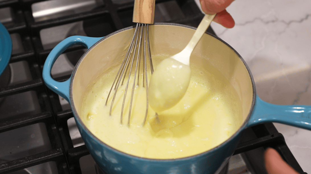 Overhead view of pastry cream in a pot after thickening.