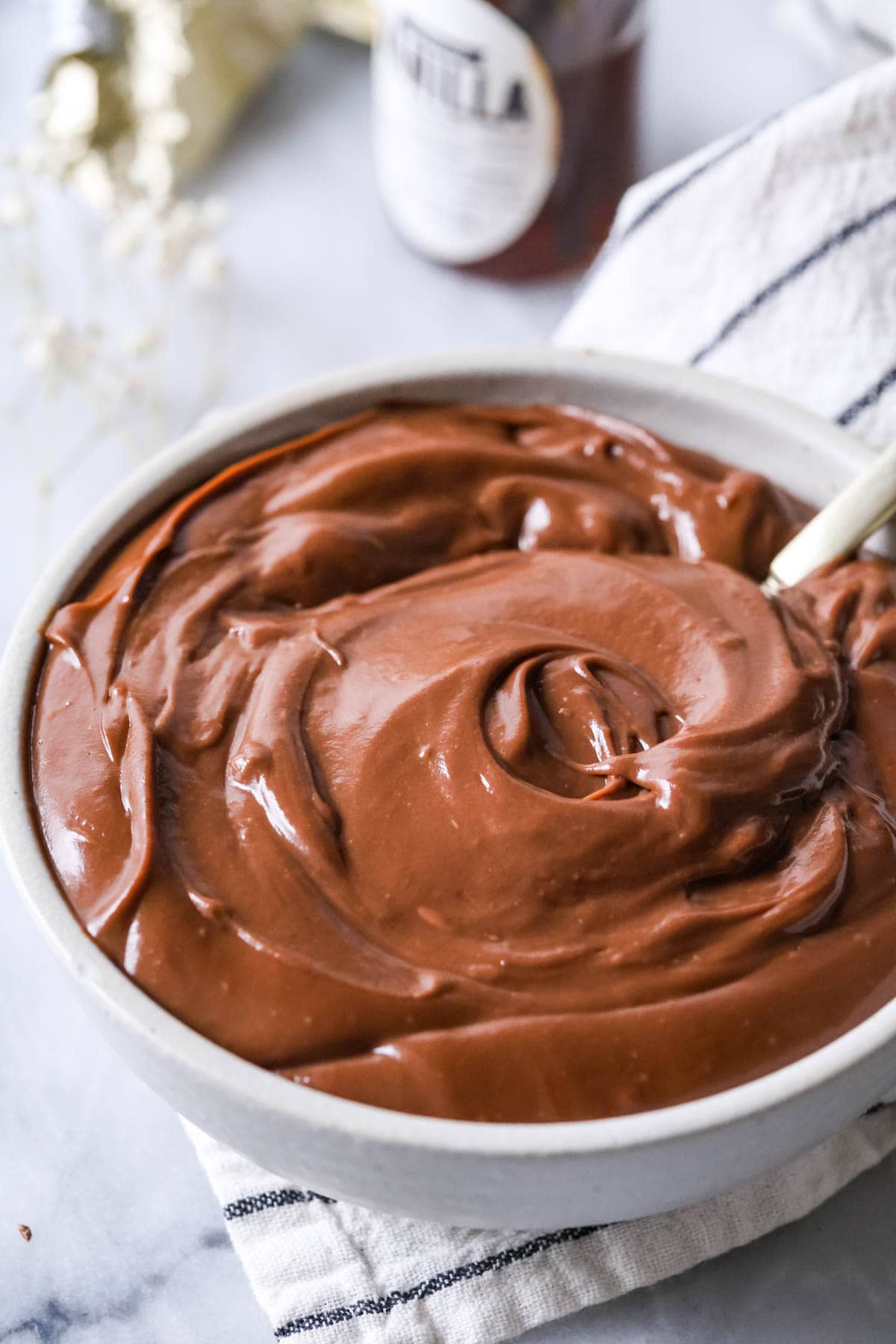 Bowl of pastry cream made with chocolate.
