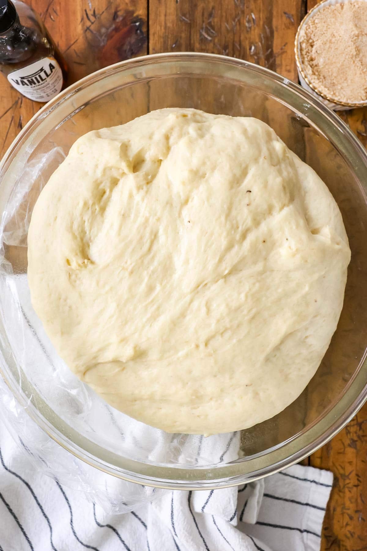 Overhead view of a bowl of dough after rising.