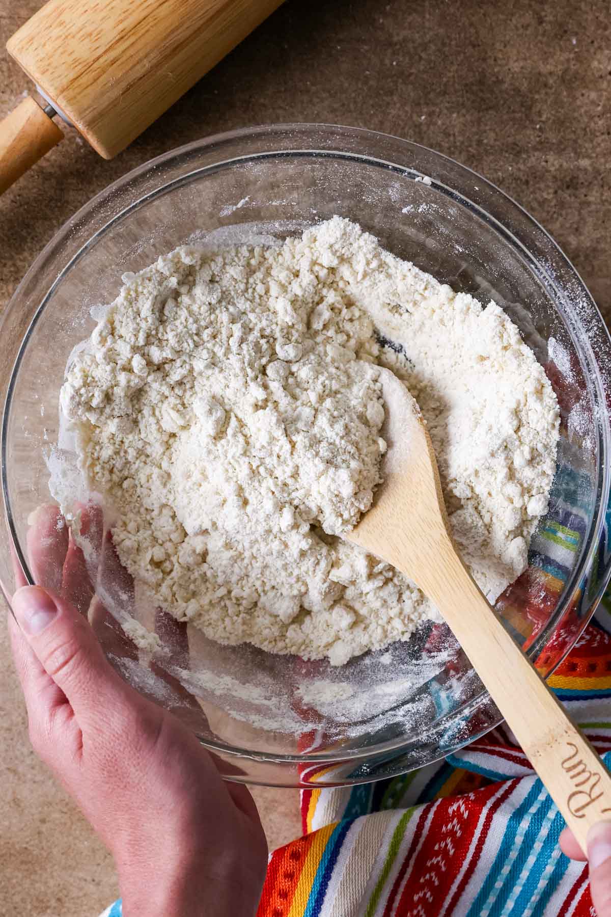Bowl of dry ingredients with bits of butter worked in.
