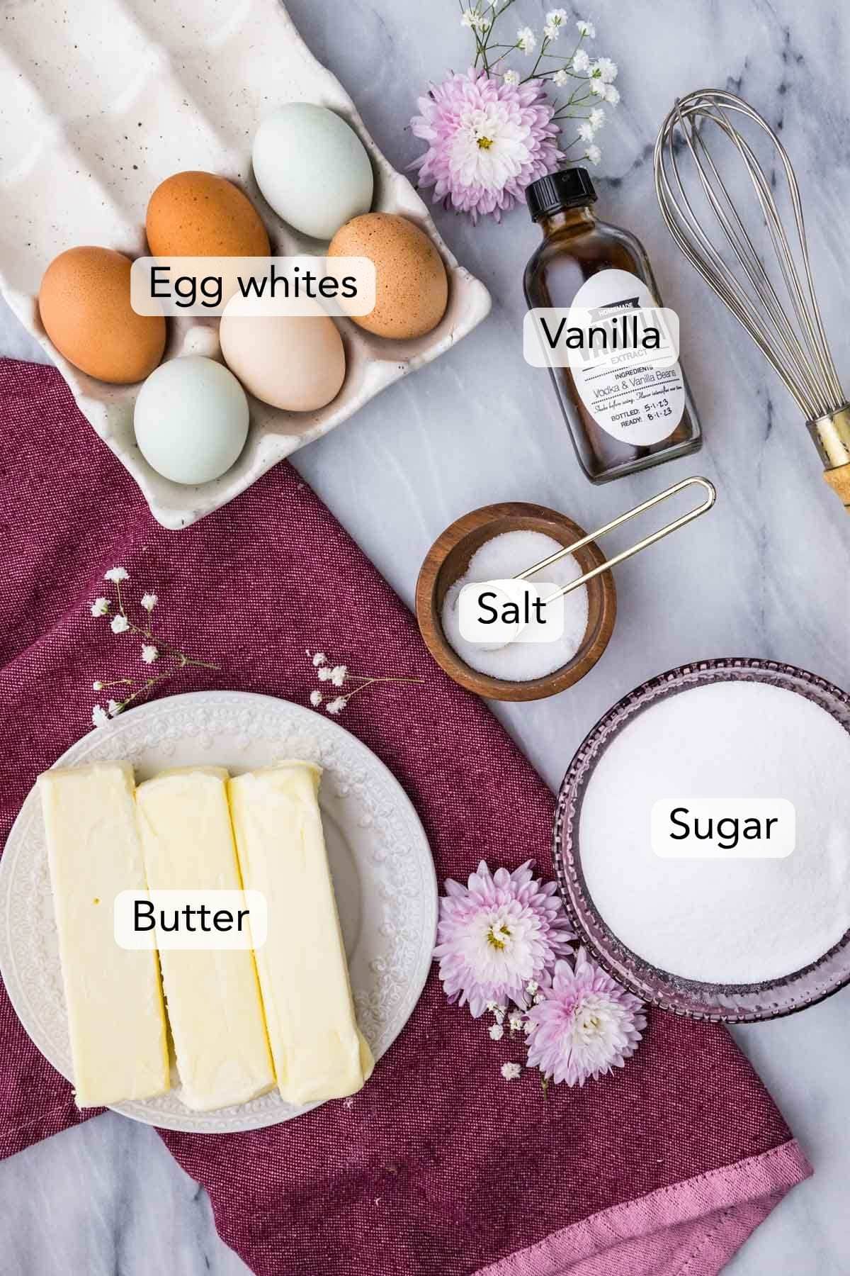 Overhead view of ingredients including butter, eggs, sugar, and more.